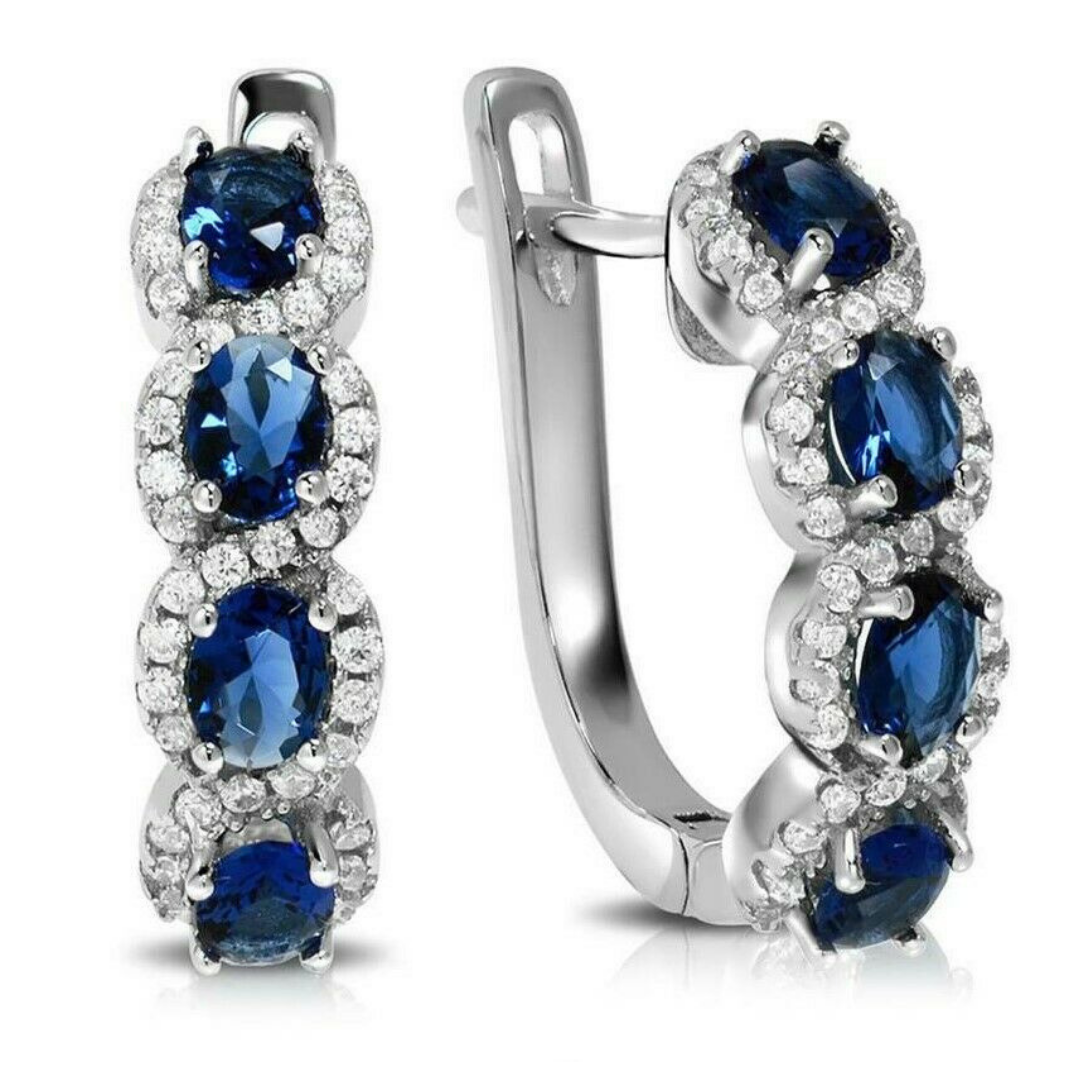 Blue & White Sapphire Halo Huggie Earrings in 18K White Gold